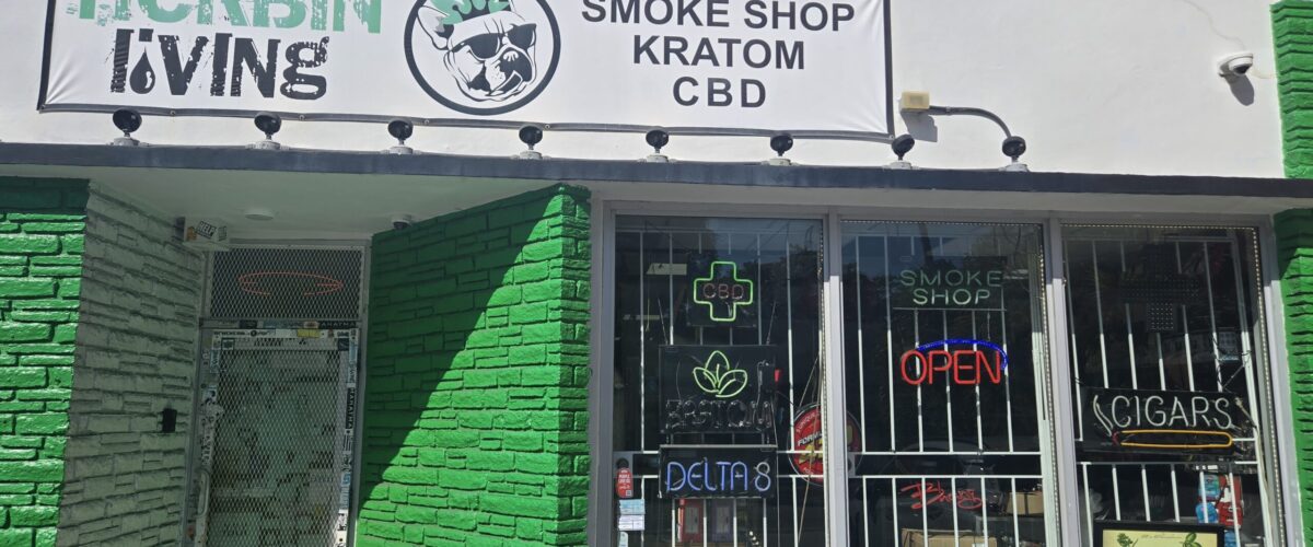 Herbin Living Smoke Shop & Kratom Lounge storefront in Miami, featuring bright green accents and signage in "The Best Kratom Shops in Miami."